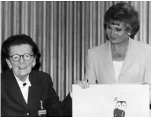 Norma Skemp receiving her award, presented by Angela Rippon